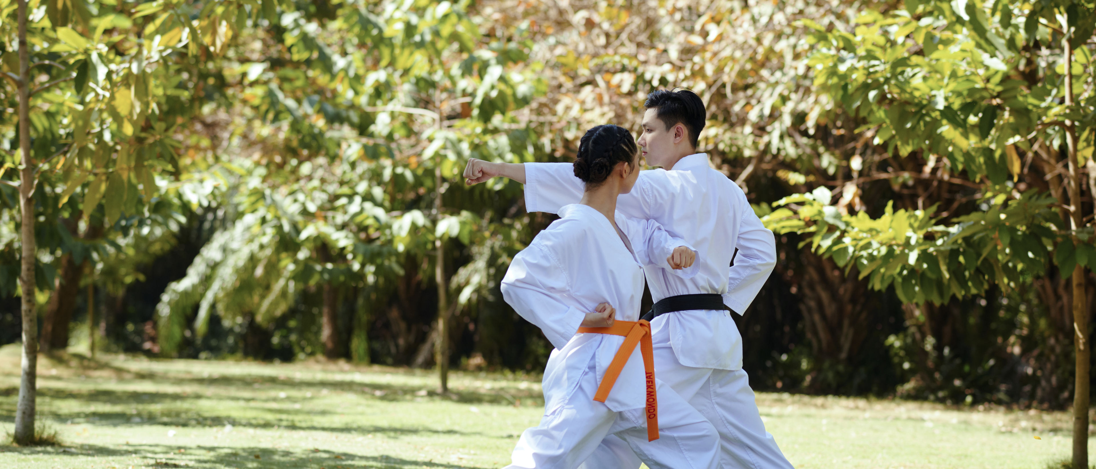 Couple practicing taekwondo