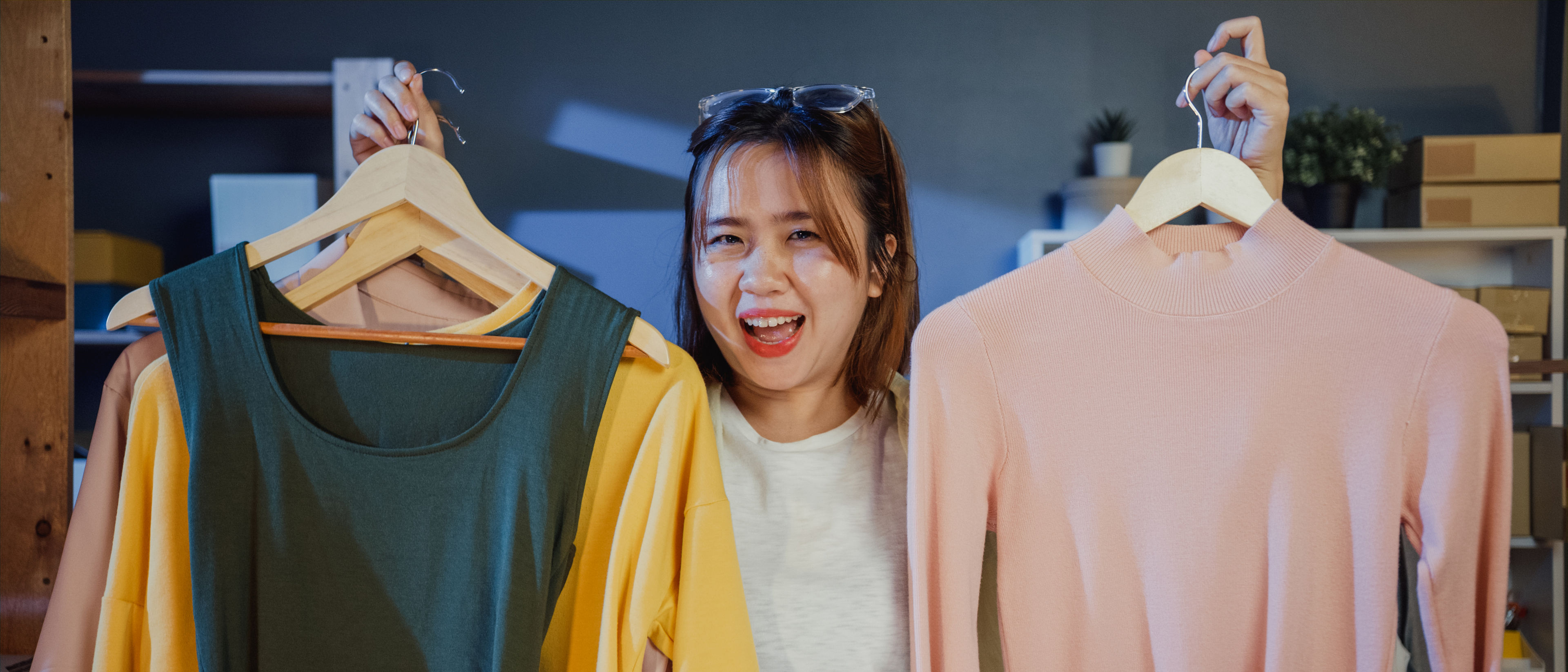 Young woman choosing new dress.